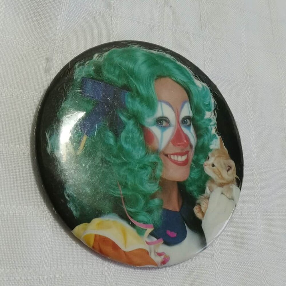 Strange & Unusual Button Pin featuring a green haired clown